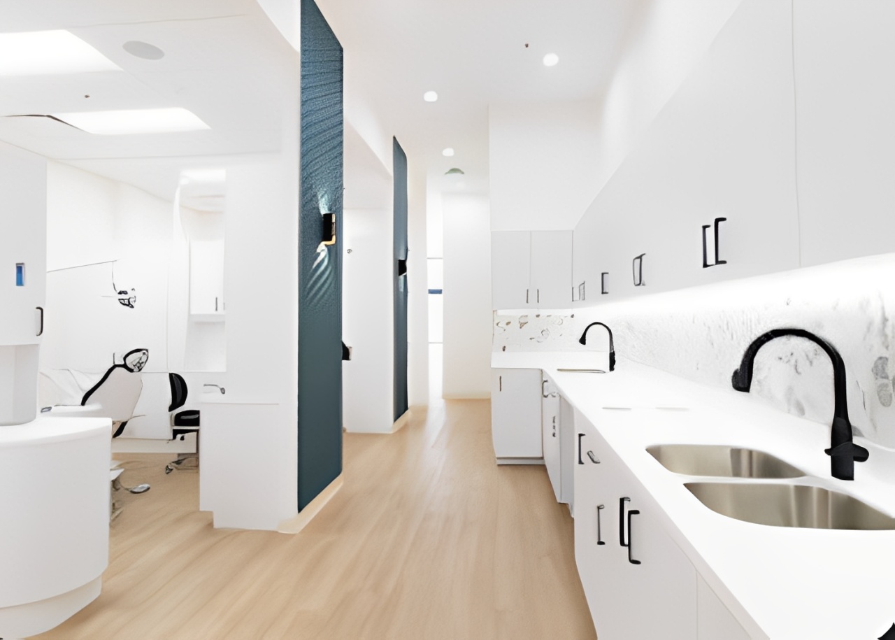 Modern, clean white restroom with sinks and mirrors.